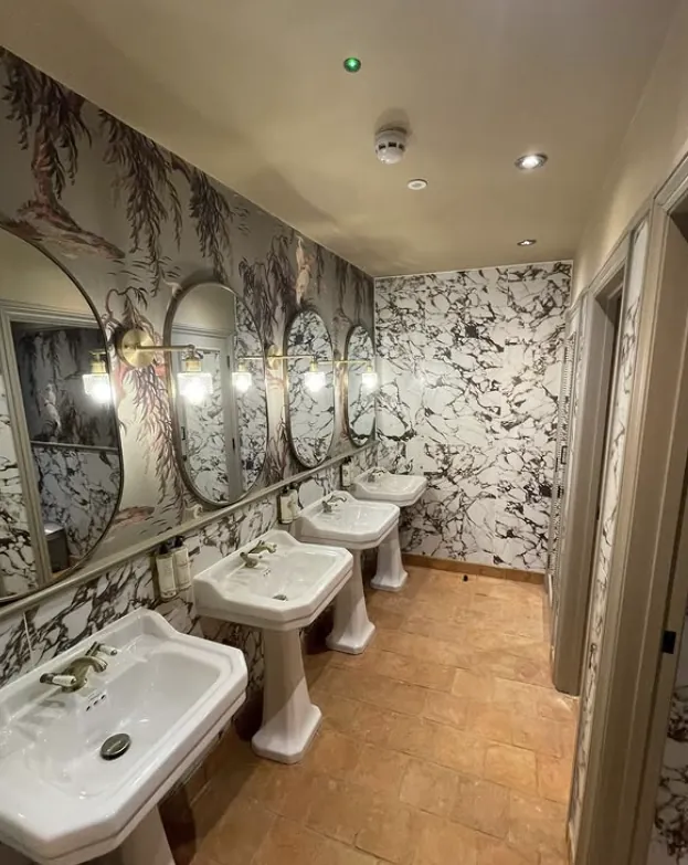 Large patterned tile floor installation in a bright open space